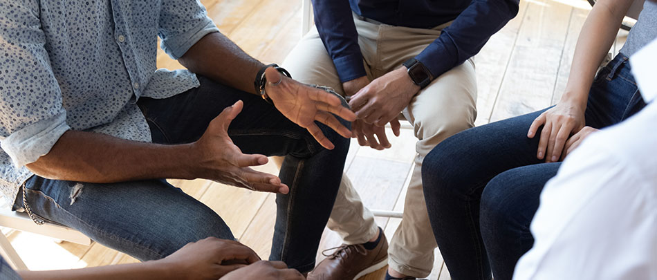 Counselor speaks at group therapy counseling session