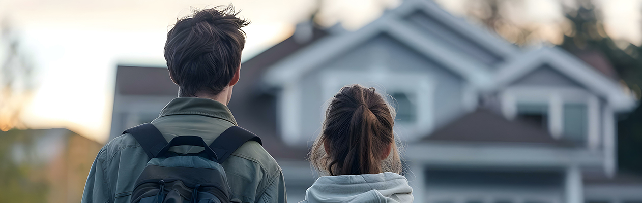 couple looking at the front of a house