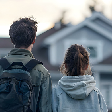couple looking at the front of a house