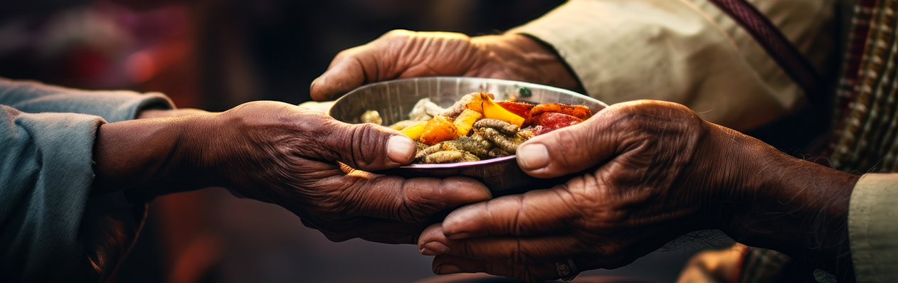 hands holding bowl of food to give to another person