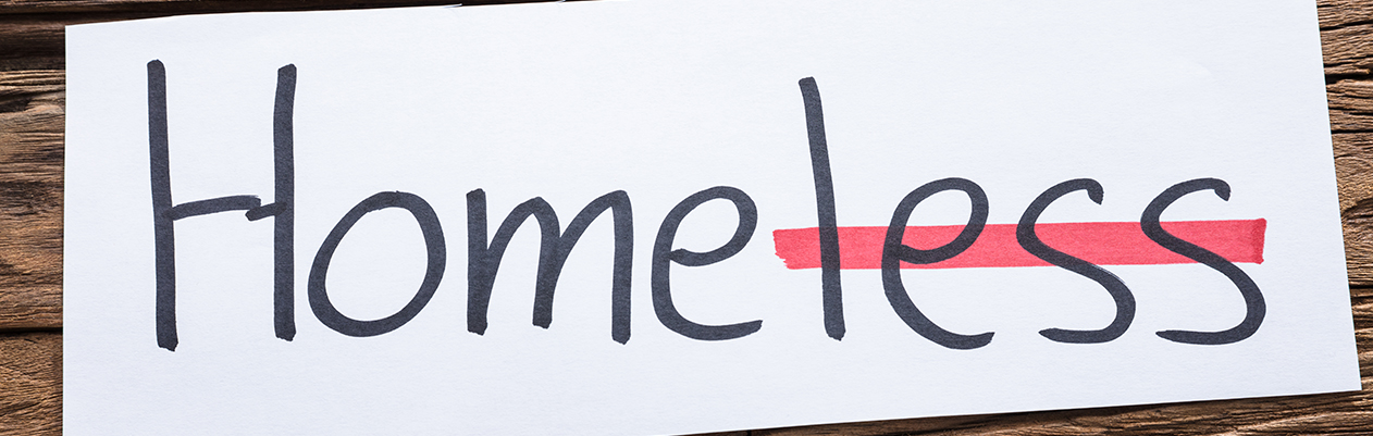 The word "Homeless" with "less" crossed out