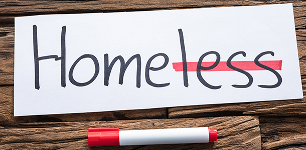 "Homeless" word with "less" crossed out