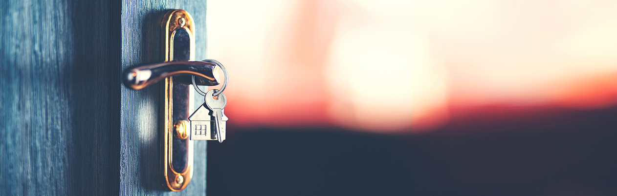keys in a front door to house