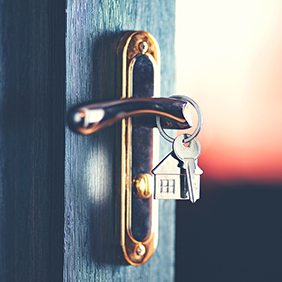 keys in a front door to a house